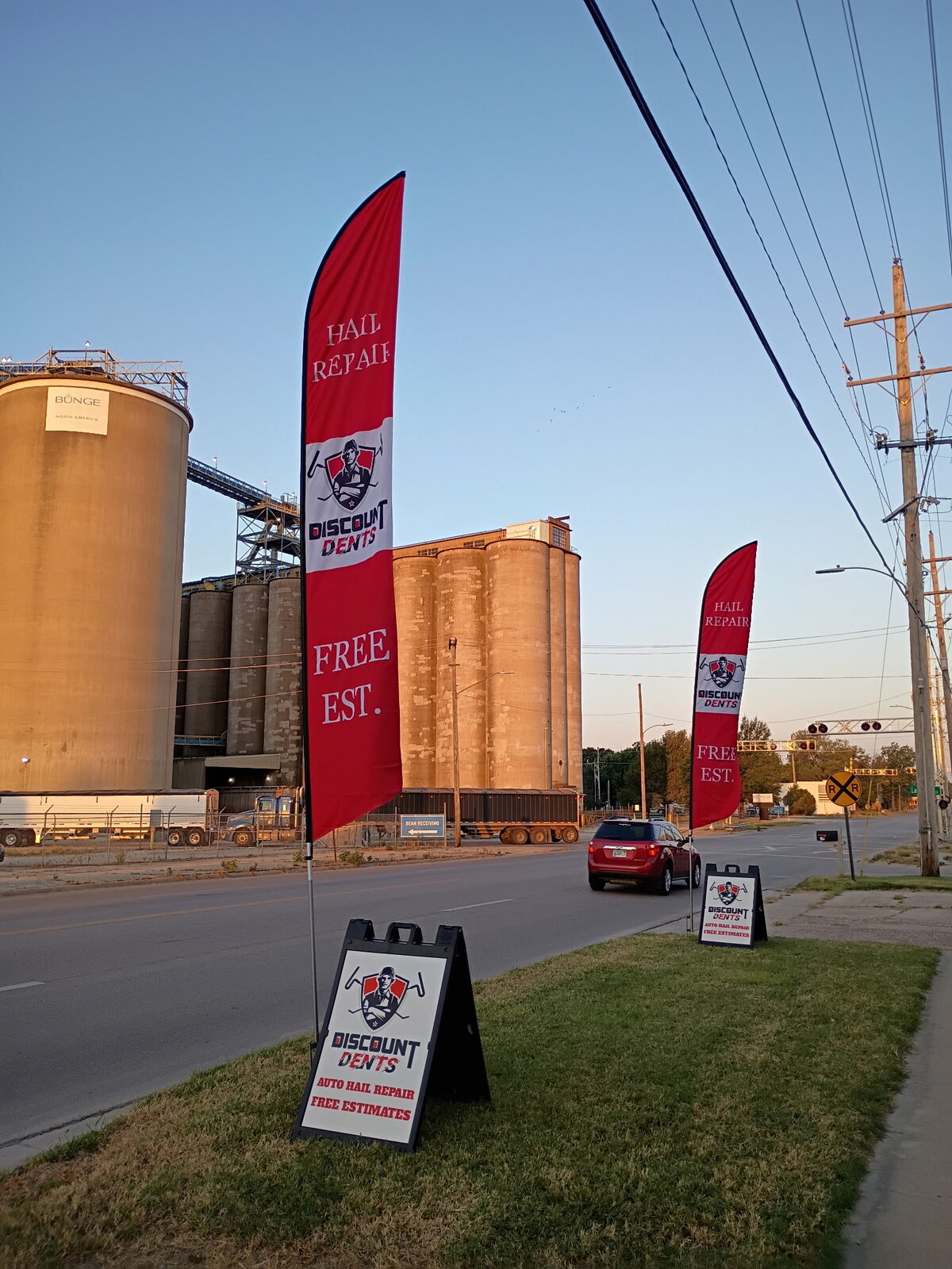 Discount Dents auto hail repair free estimates sign outside the Emporia, Kansas shop